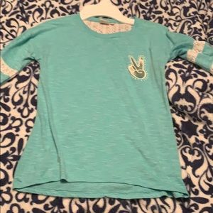 A long sleeve lace shirt in the color (bluish)